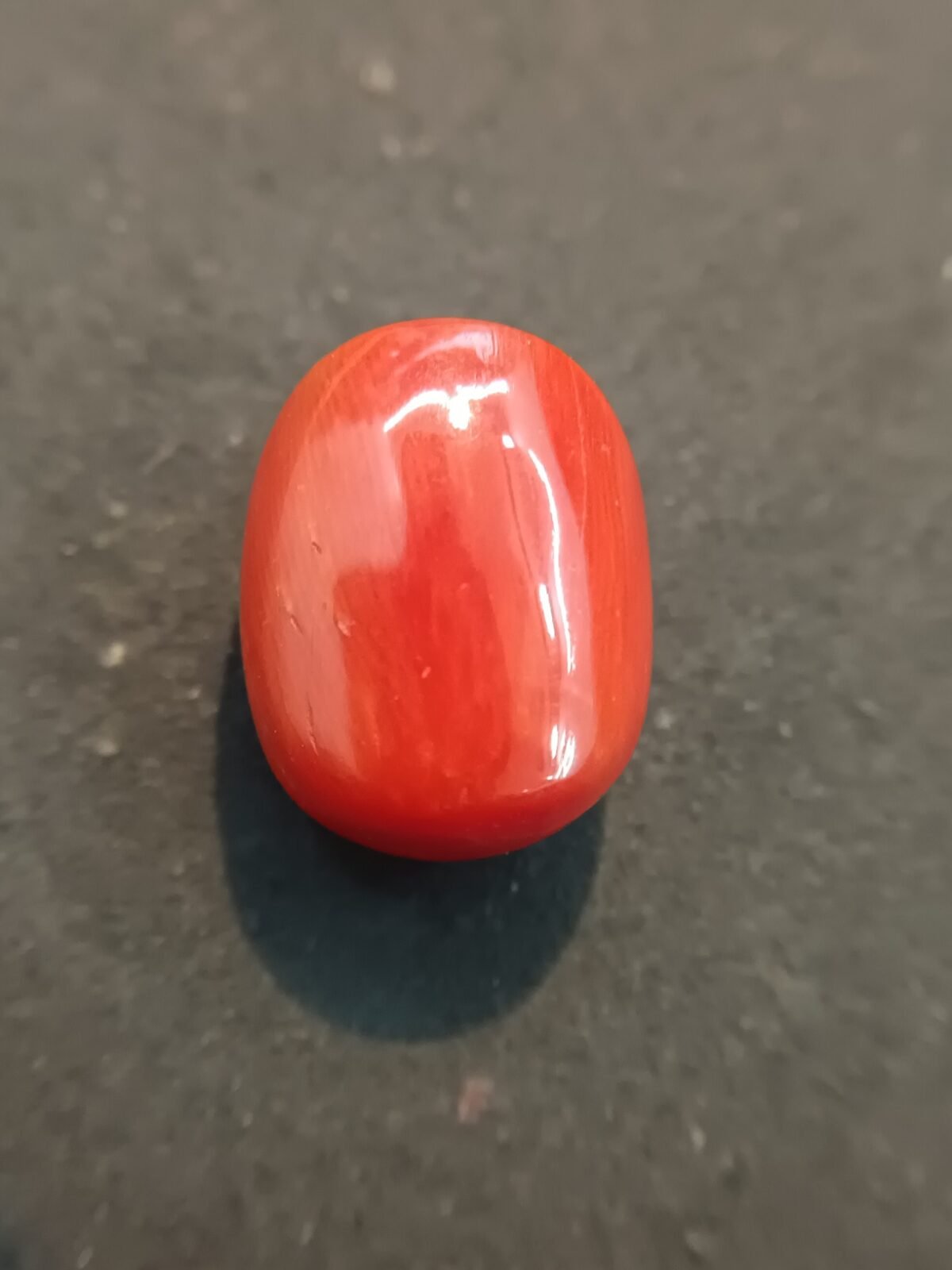 oval shaped red colour Moonga 20.72 Carat/23 Ratti